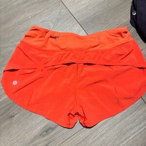 ORANGE LULULEMON SPEED UP SHORTS
